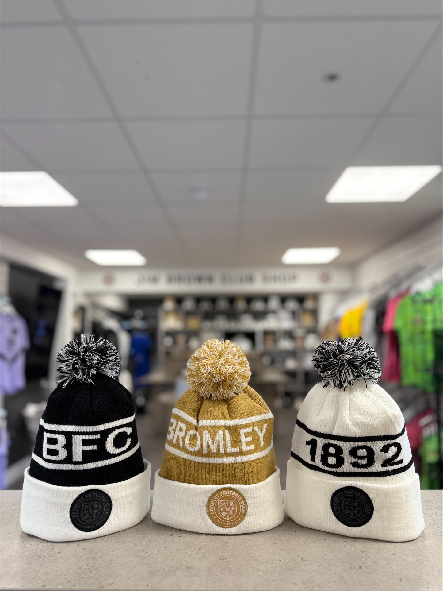 Gold and white bobble hat